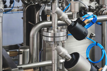 Food production machine with stainless steel pipes, cooling radiator as separator and tanks, valves and measuring instruments