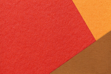 Fototapeta premium Abstract red, orange and brown paper background with copy space. Autumn template for presentation, banner