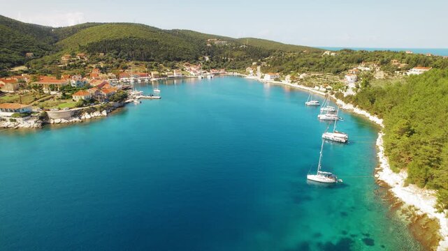Aerial view of coastal village Fiscardo and harbor with yachts in Kefalonia