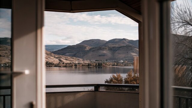 Sunny day over Osoyoos Lake in Okanagan Valley with surrounding hills and mountains