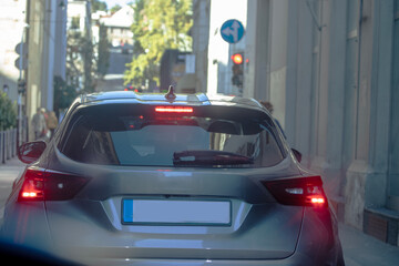 Urban Stillness — A Car Waiting at the Green Light
