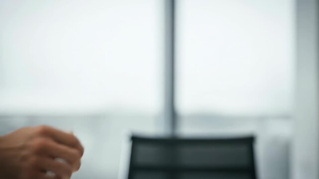 Close-up view of two hands, one outstretched to shake, the other held up in a gesture of refusal