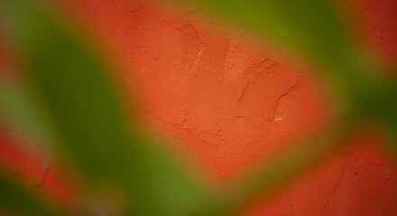 Abstract orange plaster wall texture with blurred green diagonal bands