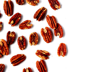 Delicious salted pecan nuts scattered.