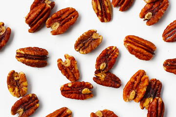 Delicious salted pecan nuts scattered.