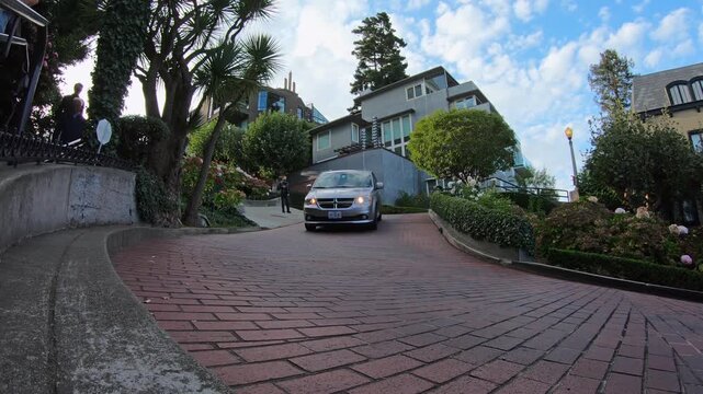 Time lapse of Lombard Street, one of the most famous landmark and the crookedest street in the world with vehicle car traffic and tourist people