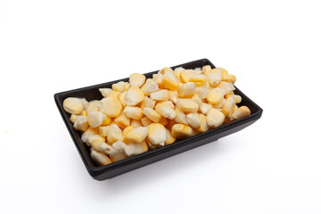 Close-up of corn kernels in a black bowl