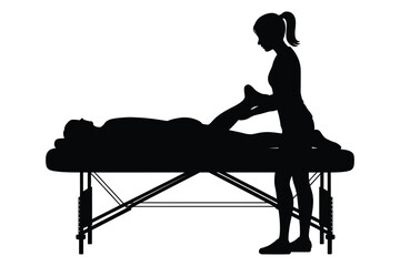 Silhouette of a person receiving a massage on a table