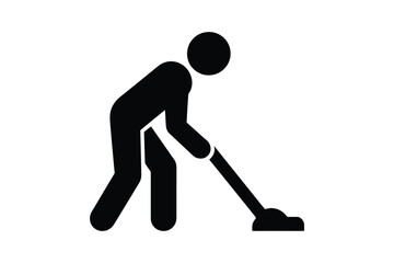 Silhouette of a person vacuuming a floor