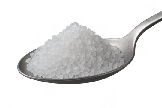 Coarse sea salt crystals filling a metal spoon