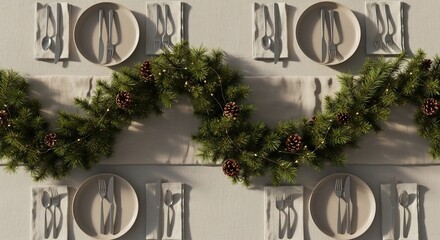 Four place settings surround a garland of pine branches cones and string lights on a tan tablecloth and runner