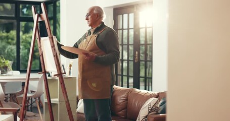 Elderly man, artist or painting with canvas in home for art, hobby or creative activity. Senior, male person or painter with brush on easel for artistic creation or artwork talent in retirement house