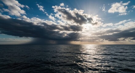 Obraz premium Dramatic sunset over a turbulent sea with dark clouds