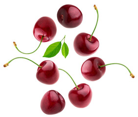 seven ripe dark red cherries and fresh green leaves arranged in a circular pattern, isolated on a...