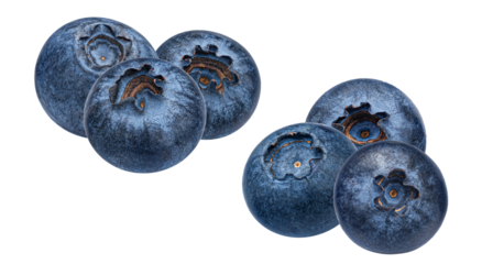 arrangement of fresh, large, and ripe blueberries separated into two distinct clusters, emphasizing their rich color and texture, isolated on black.