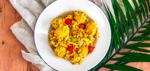 Traditional Brazilian dish of rice, chicken, and pequi (Brazilian caryocar), known as Goiana chicken stew.