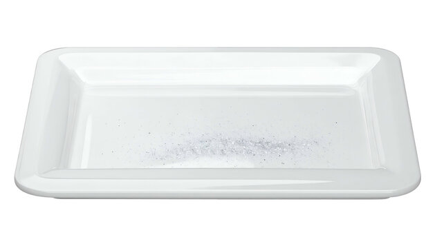 A white, rectangular dish holds a small pile of granular, white substance. Dark background