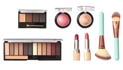 neatly arranged collection of essential beauty and makeup products displayed horizontally, including palettes, brushes, and lipsticks, isolated studio shot.
