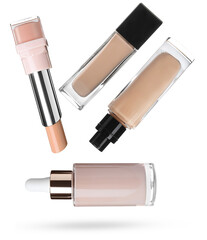 high-end makeup base products collection, featuring a serum dropper bottle, solid concealer stick, and two varying glass liquid foundation bottles, arranged diagonally on black.
