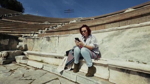 Archaeology Student Talking to Cellphone in the Ancient Rome Hospital Asclepieion of Pergamon