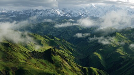 Obraz premium Majestic mountain range overlooking lush green valley aerial view nature photography serene environment