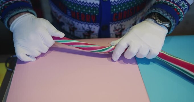Chef making traditional Christmas holiday peppermint candies sticks, slow motion