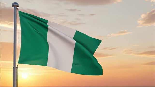 National flag of nigeria nation waving on the wind with a beautiful sunset on the background, banner of the country