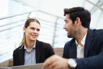 Businessperson discussing data and insurance sales in city.