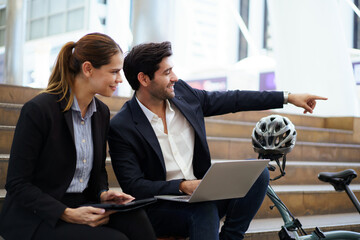 Businessperson discussing data and insurance sales in city.