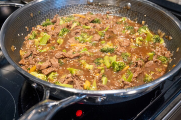 Delicious Beef and Broccoli Stir-Fry Cooking in a Pan on the Stove