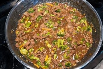 Delicious Beef and Broccoli Stir-Fry Cooking in a Pan on the Stove