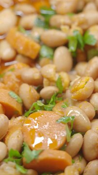 Creamy bean dish with carrots and herbs for a healthy meal