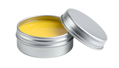 Open silver tin filled with yellow salve; lid to side, against dark backdrop