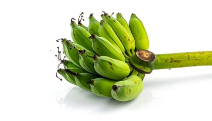 Bunch of unripe green bananas resting on a white surface