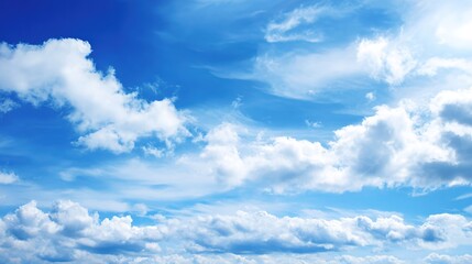 Obraz premium Bright Blue Sky with Fluffy White Clouds Background Image—Perfect for Wallpapers, Web Design, Social Media Graphics, or Decor Projects, Evoking Freshness, Serenity, and a Lighthearted Vibe