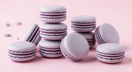 Obraz premium Elegant Lavender Macarons - A Sweet Treat on a Pink Background.