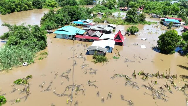 30,Sep,2025,Sena Ayutthaya, a storm and heavy rain caused water to overflow from the river and flood houses along the river called Mae Nam Noi in the rural area of Ayutthaya, Thailand.
