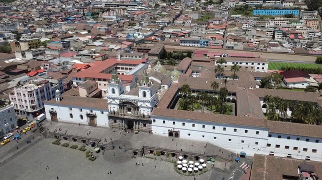 Aerial drone shot of San Francisco Church in Quito, Ecuador with colonial plaza
