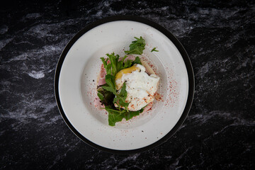Gourmet Poached Egg Breakfast on Dark Marble