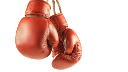 Pair of red leather boxing gloves hanging against a dark on transparent background