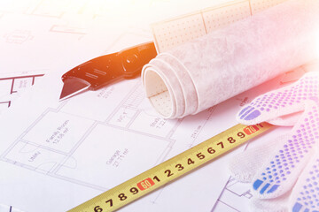 Building plan. Linoleum and flooring installation tools. Repair in the house..