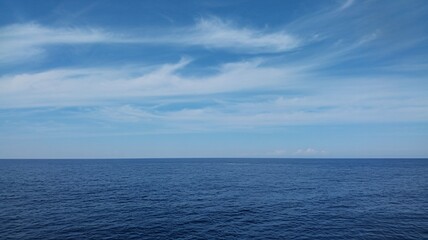 Obraz premium Joyful woman embracing winter snow with happy smile and warm knitwear