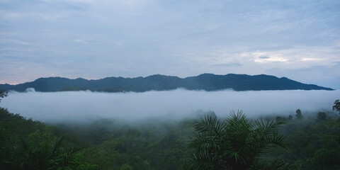 Fototapeta premium Landscape image of mountains peak and sky with the sea of clouds