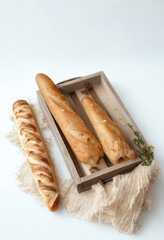 Rustic bread selection in a wooden tray with linen