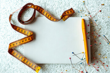 Measuring tape and notebook for creative projects and design planning