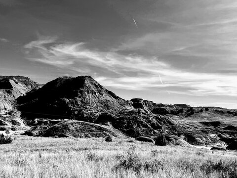 Shadows bound a rugged hilltop in the Eastern Montana badlands