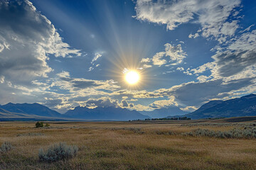 A sun halo glowing softly behind drifting clouds at midday