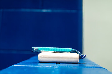 Solomons, Maryland USA A bar of soap and a razor on a shelf.