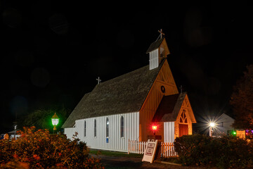 Solomons,  Maryland USA The small Saint Peter's Episcopal Church at night with red lights.