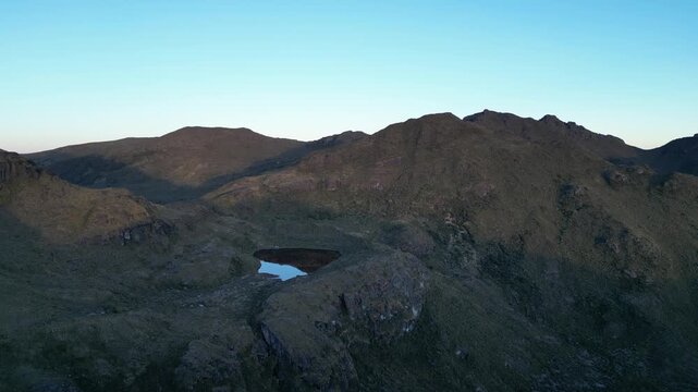 Landscape overlooking Ditkevi Lagoon with mountains surrounded by highland paramo vegetation on a sunny morning in Chirripo National Park - DJI_0741